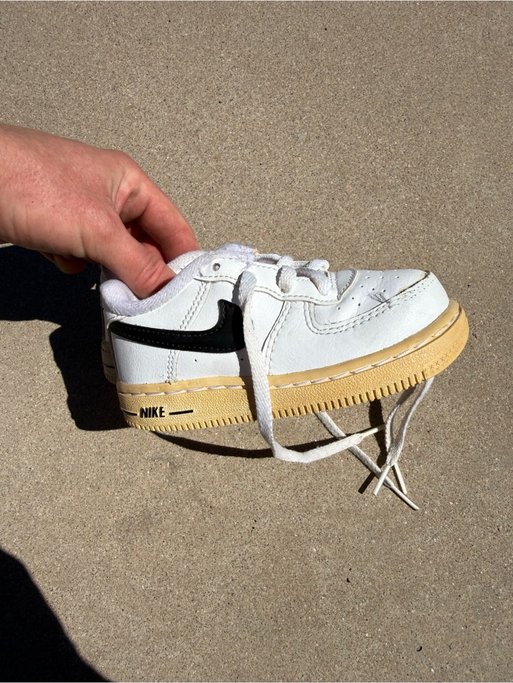 Nike Kids White Leather Sneakers with Black Swoosh and Gum Sole